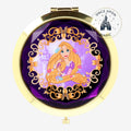 Once Upon Magic gold compact mirror with Rapunzel illustration on purple background, ornate gold trim.