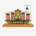 Once Upon Magic Disney Theater light-up figurine featuring Art Deco architecture, gold accents, and pink curtains.