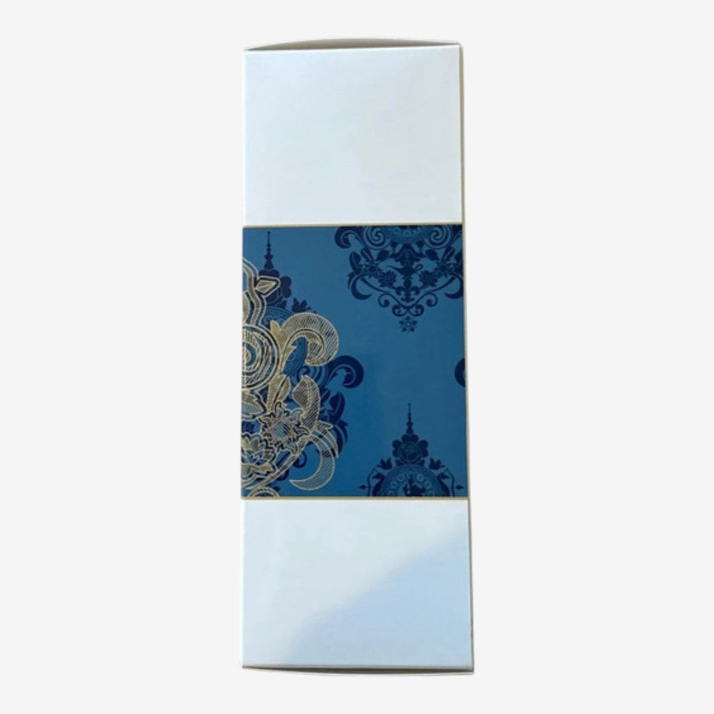 Once Upon Magic Disneyland Hotel room spray with blue and gold ornate pattern on a white box.
