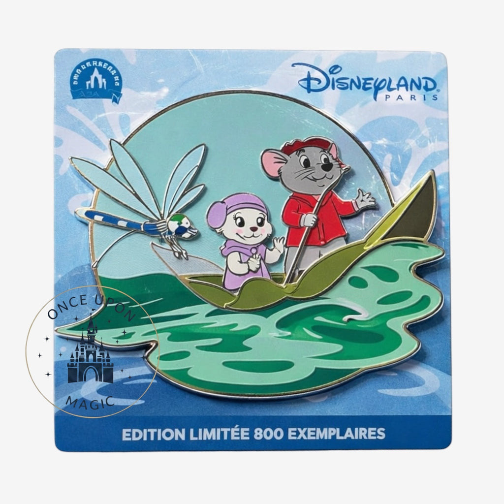 Once Upon Magic Bernard & Bianca enamel pin featuring the duo in a boat with a dragonfly. Bernard wears a red jacket, Bianca a lavender hat and dress. Teal water and blue sky background.