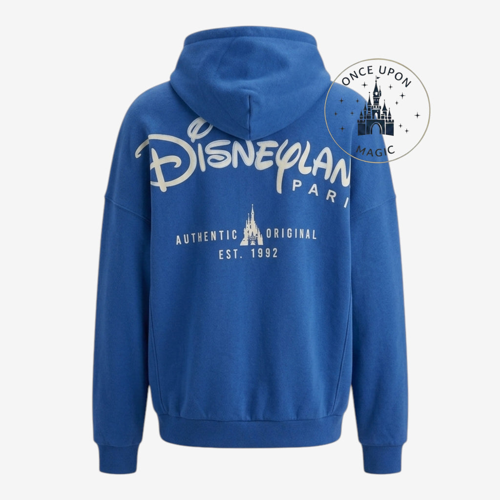 Once Upon Magic blue Disneyland Paris hoodie with "Est. 1992" castle graphic on back.