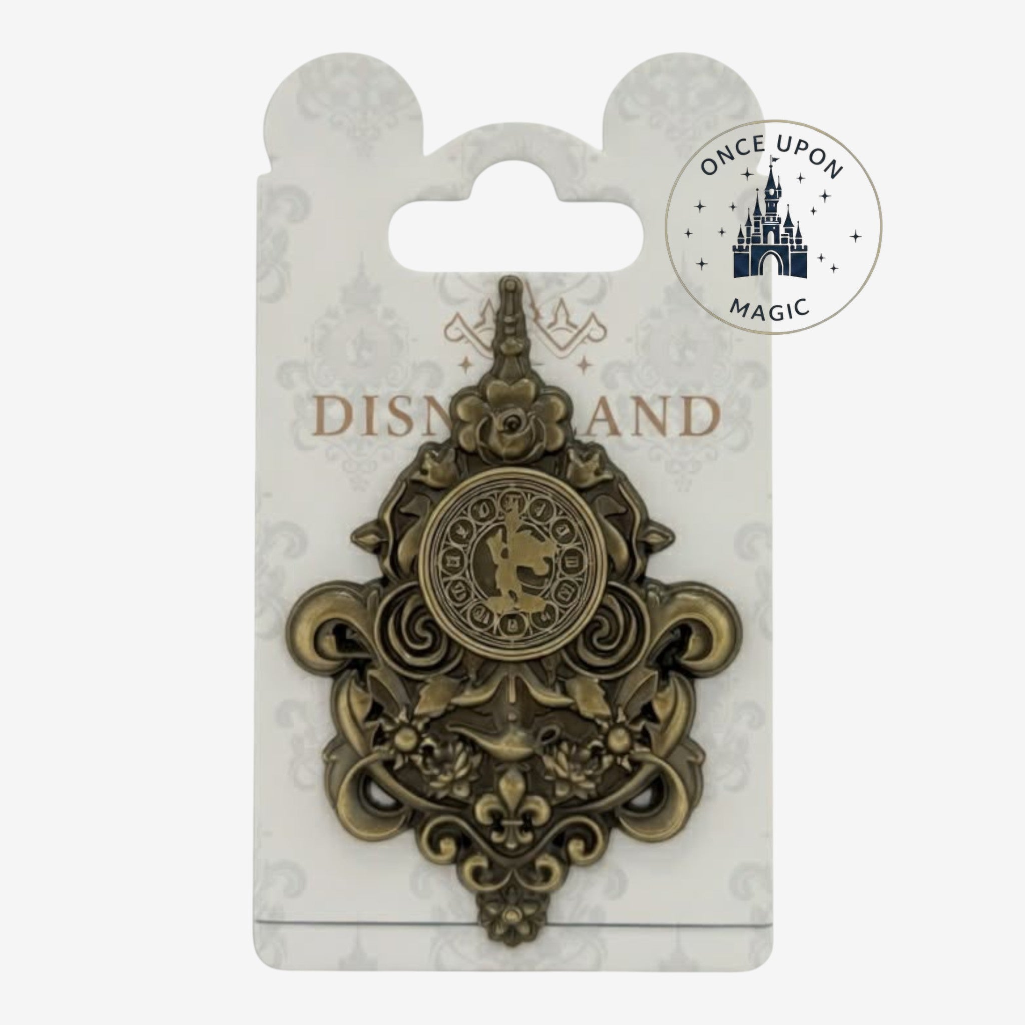 Once Upon Magic exclusive Disneyland Paris Hotel collector's pin, antique gold metal with ornate scrollwork and a central circular design.