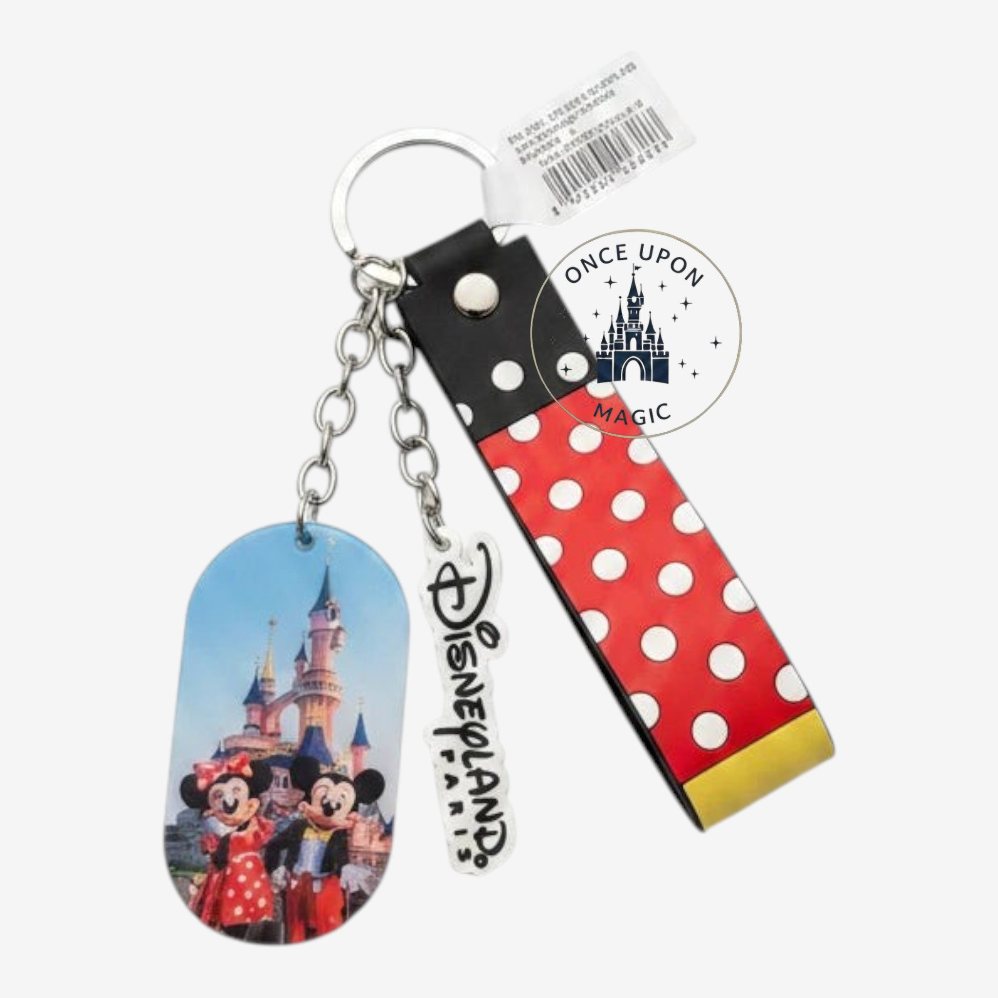 Once Upon Magic Disneyland Paris keychain featuring Mickey and Minnie Mouse in front of the castle with a polka dot tag