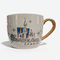 Once Upon Magic Disneyland Paris 2024 ceramic mug with castle graphic and gold handle.
