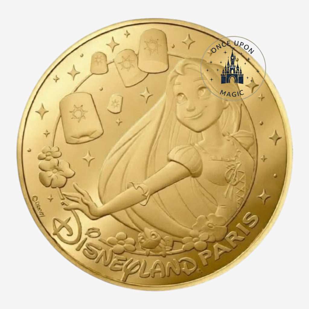 Once Upon Magic gold coin featuring Rapunzel and floating lanterns, Disneyland Paris 2026 collectible