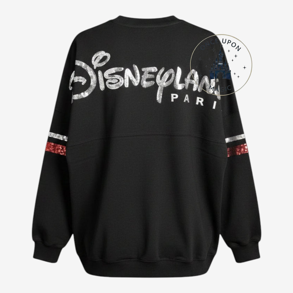 Once Upon Magic black Disneyland Paris spirit jersey featuring silver sequin lettering and striped sleeve details.
