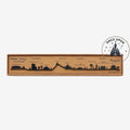 Once Upon Magic Disneyland Paris Adventure World skyline decoration. Black silhouette art on brown cardboard.