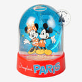 Once Upon Magic Disneyland Paris snow globe featuring Mickey and Minnie Mouse with Paris landmarks in the background.