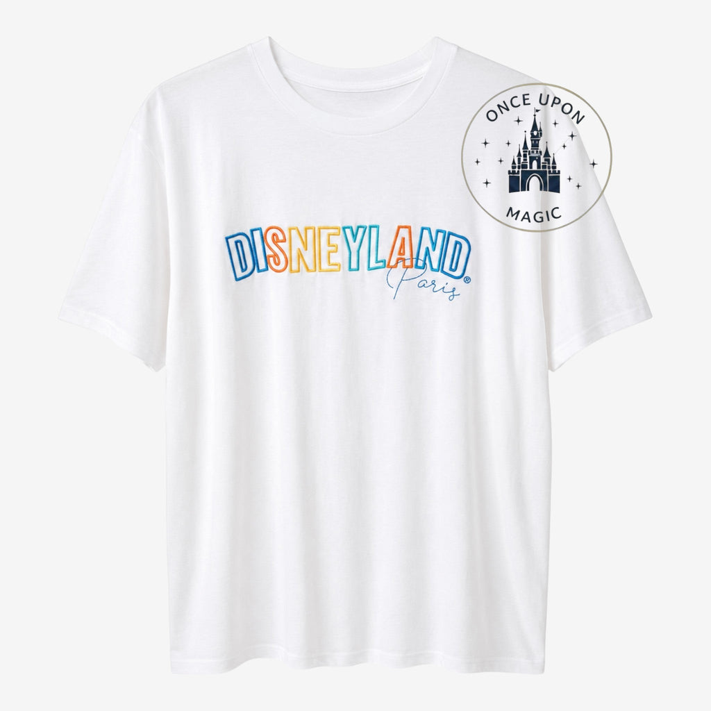 Once Upon Magic white cotton t-shirt with colorful Disneyland Paris embroidered text graphic.