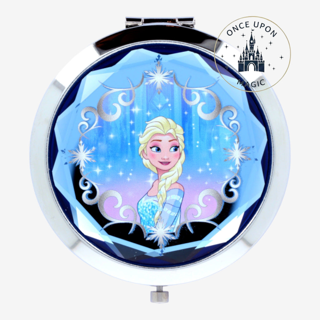 Once Upon Magic Elsa compact mirror with silver trim and blue faceted gem-like border, featuring Elsa from Frozen.