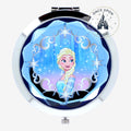 Once Upon Magic Elsa compact mirror with silver trim and blue faceted gem-like border, featuring Elsa from Frozen.