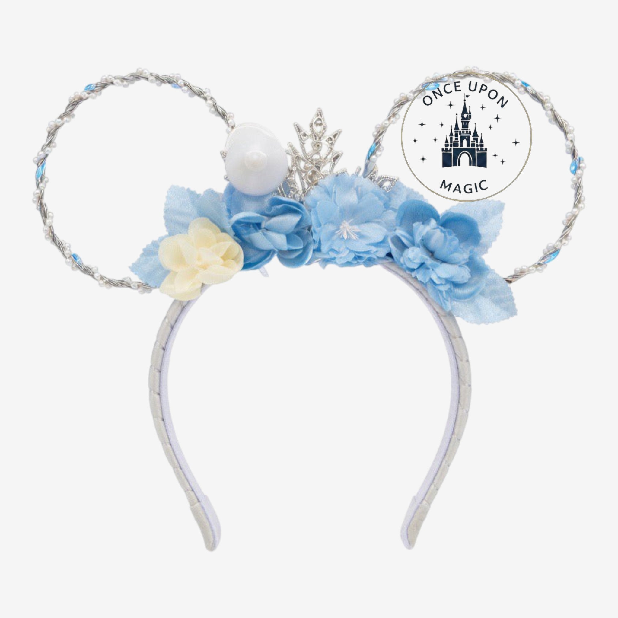 Once Upon Magic Elsa Frozen ears headband with blue flowers, pearl trim, and a silver snowflake crown. Light-up feature.