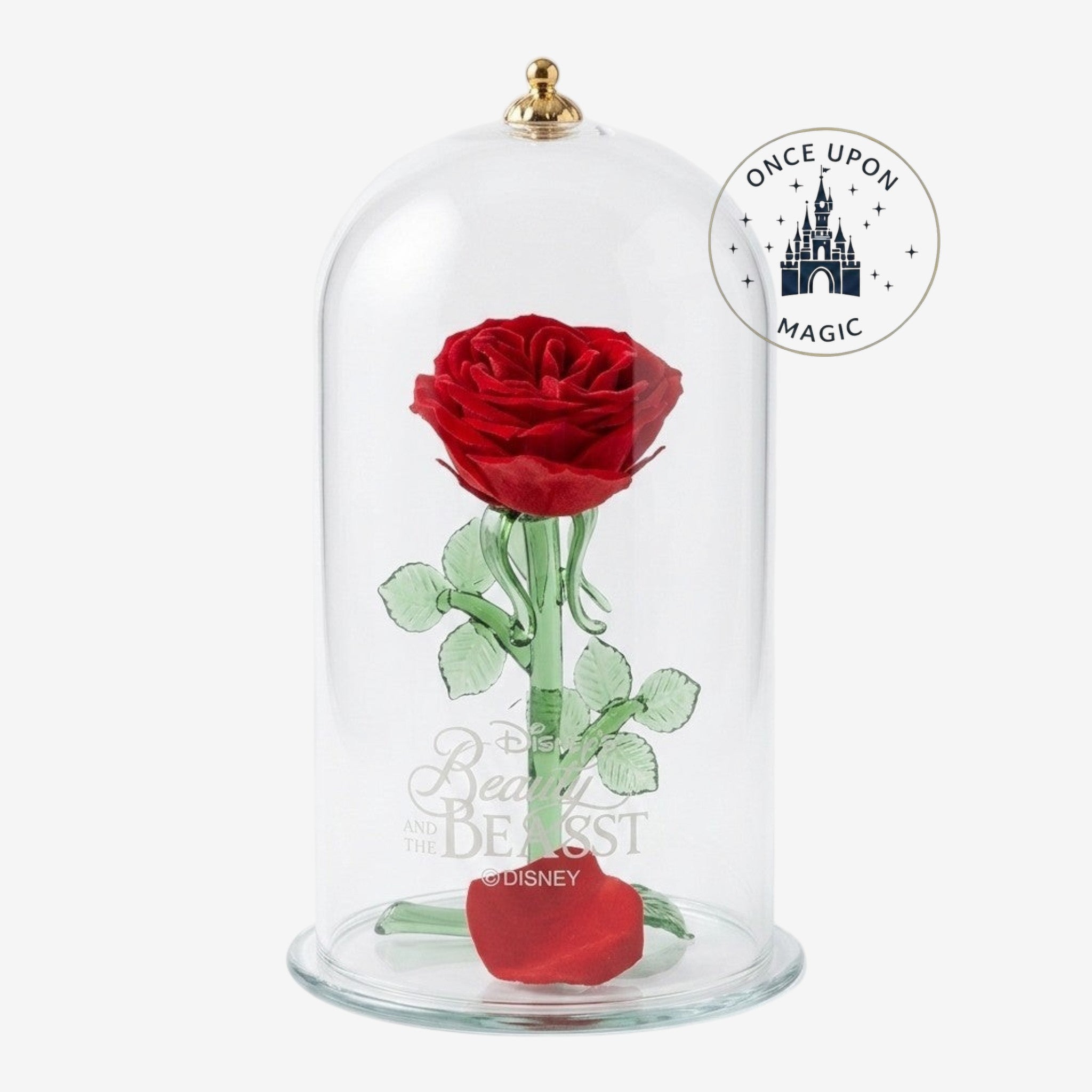 Once Upon Magic Enchanted Rose Dome: a preserved deep red rose with glass stem and leaves under a glass dome, featuring a gold finial and etched Beauty and the Beast logo.