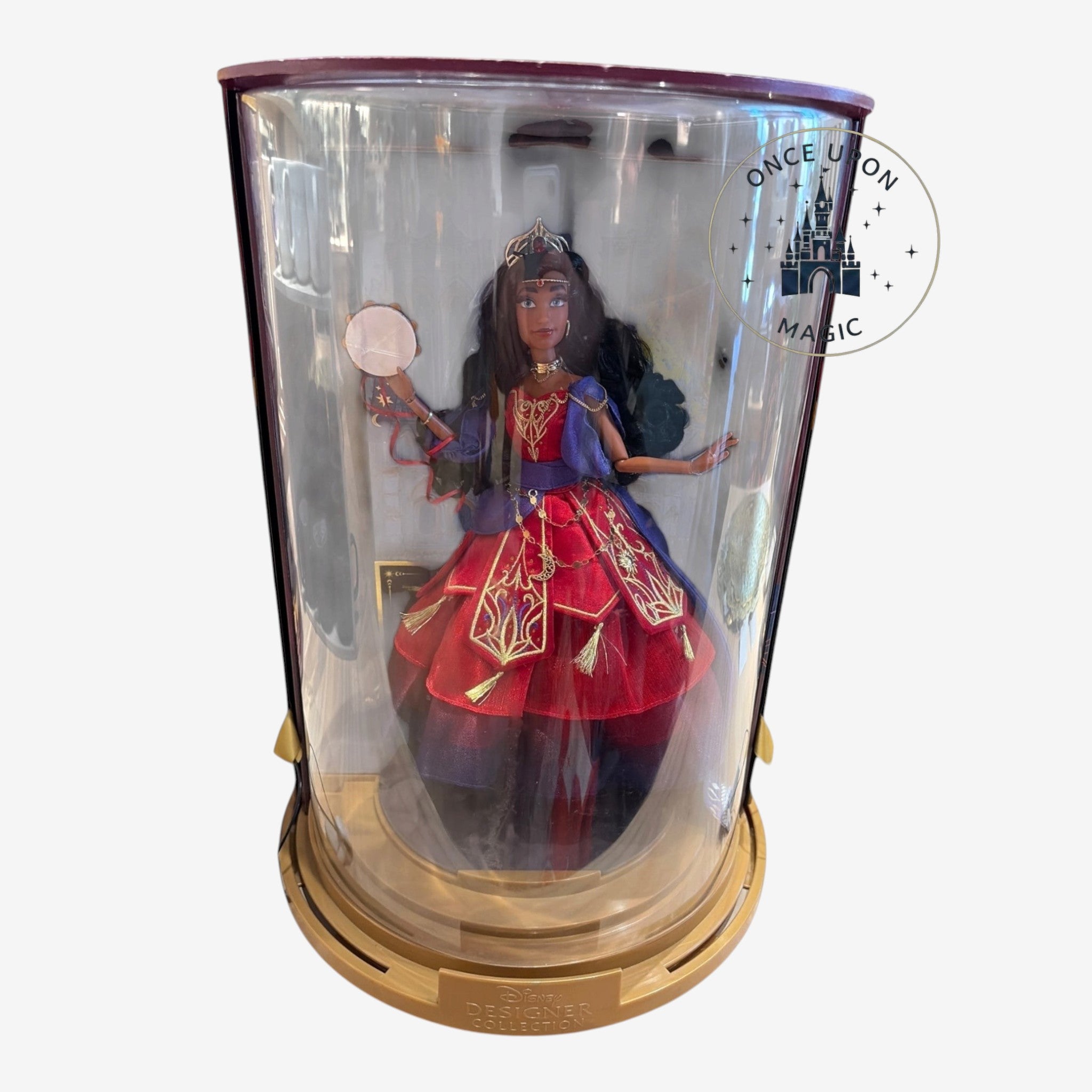 Once Upon Magic collector Esmeralda doll from The Hunchback of Notre Dame in a display case with tambourine accessory