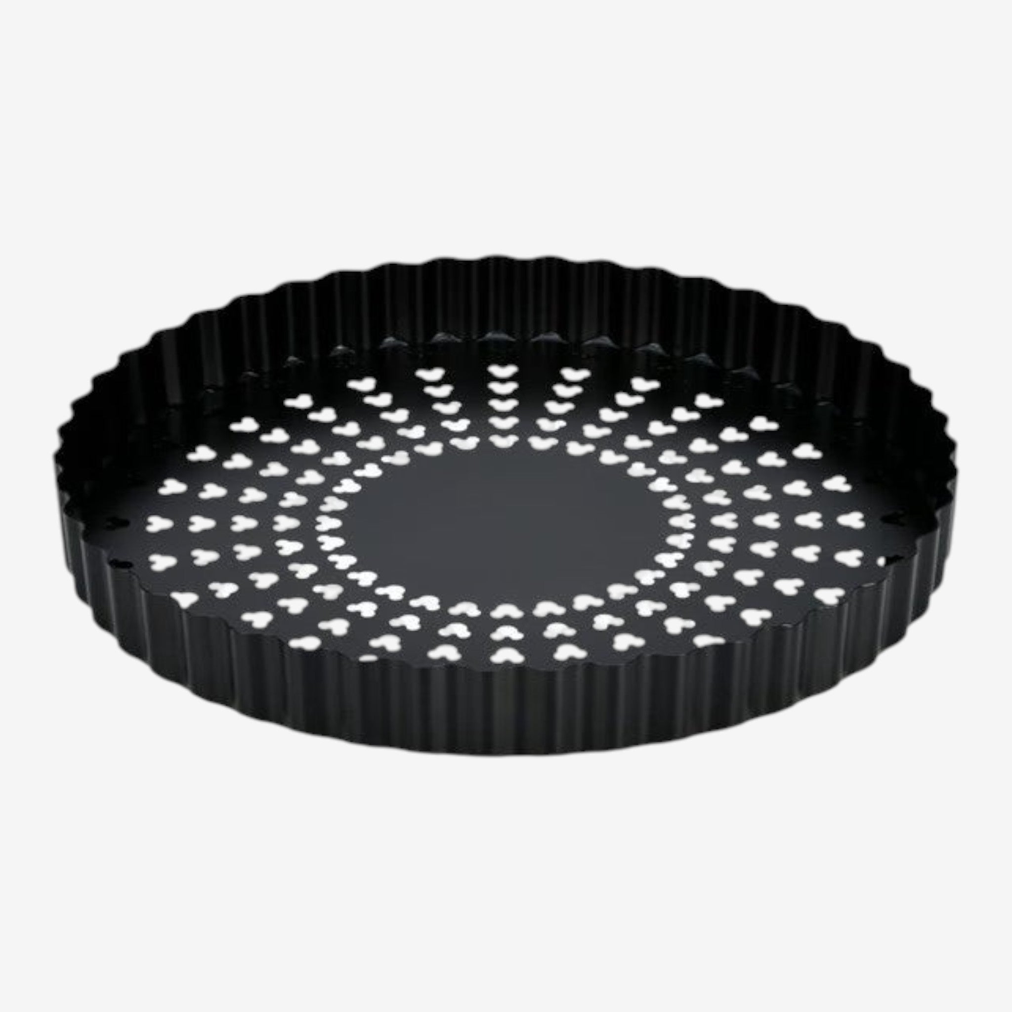 Once Upon Magic black fluted tart pan with removable bottom and perforated surface for even baking.