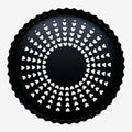 Once Upon Magic black fluted tart pan with removable bottom and perforated surface for even baking.