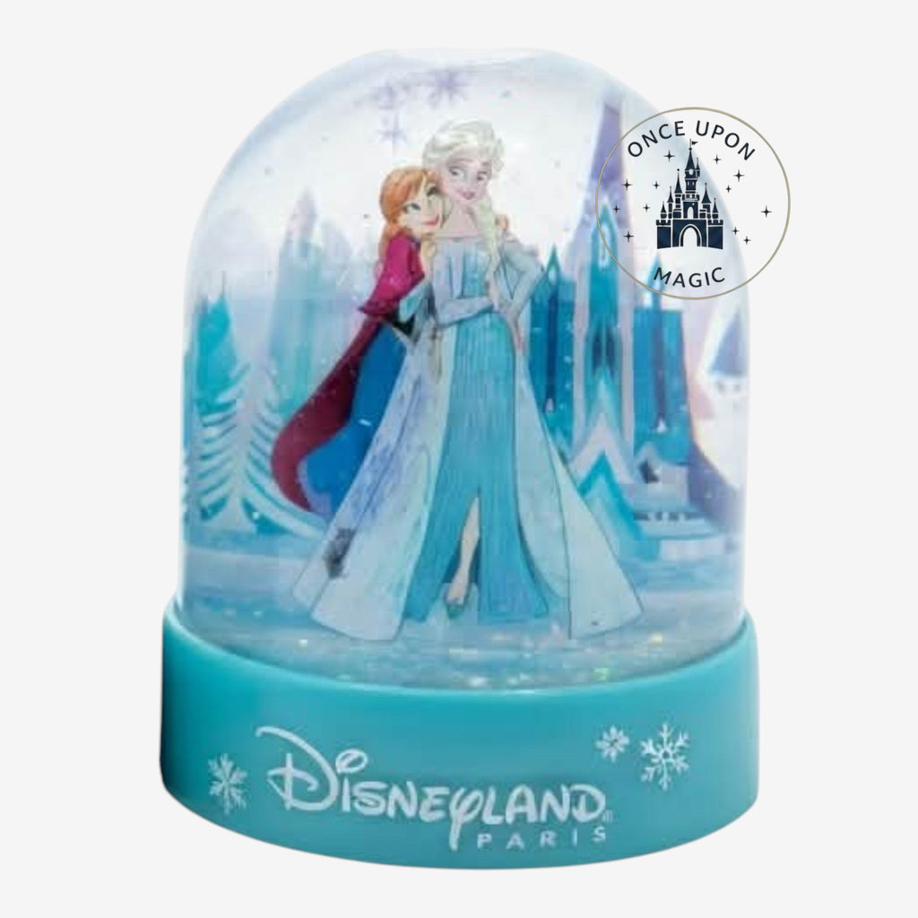 Once Upon Magic Frozen snow globe featuring Elsa and Anna in front of the ice castle with a blue Disneyland Paris base
