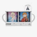 Once Upon Magic set of 2 Frozen mugs featuring Elsa and Anna with castle and snowflake designs. Ceramic.