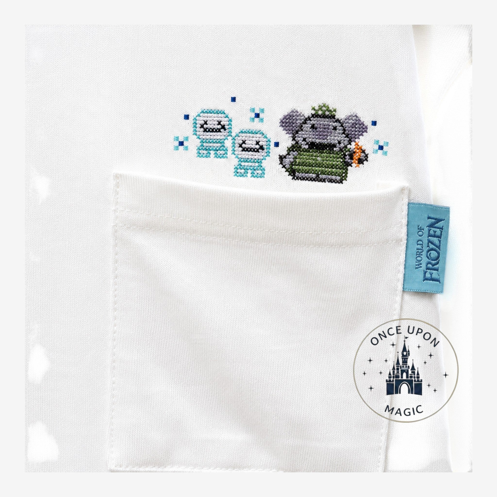 Once Upon Magic white cotton t-shirt with World of Frozen embroidered characters Olaf and Snowgies on the chest pocket.