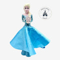 Once Upon Magic Frozen character handheld spinning fan featuring Elsa in a shimmering blue gown with a fabric skirt.