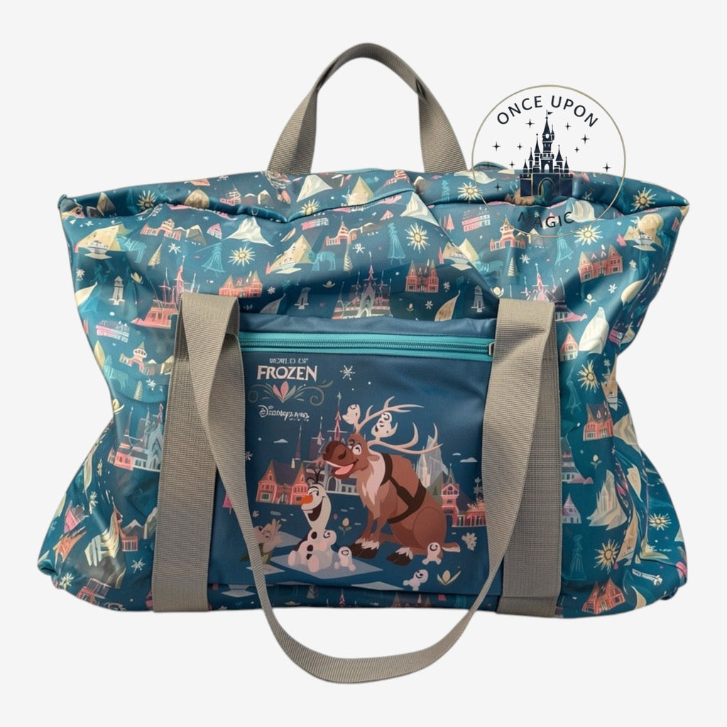 Once Upon Magic World of Frozen tote bag with Olaf, Sven, and Arendelle castle print. Teal blue with grey straps.