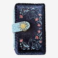 Once Upon Magic dark blue velvet wallet with Anna & Elsa floral embroidery and Arendelle sun clasp.