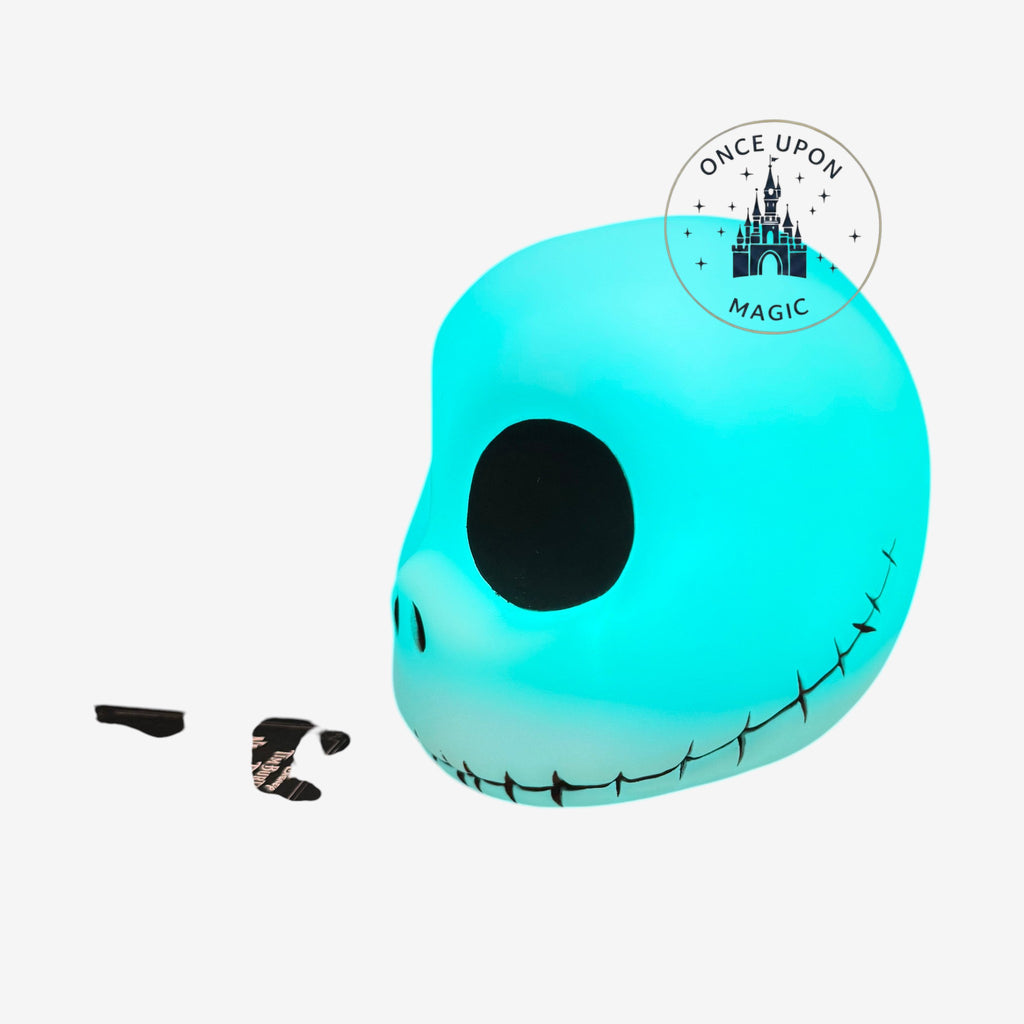 Once Upon Magic Jack Skellington mood light glowing in bright cyan with iconic stitched smile and hollow eyes