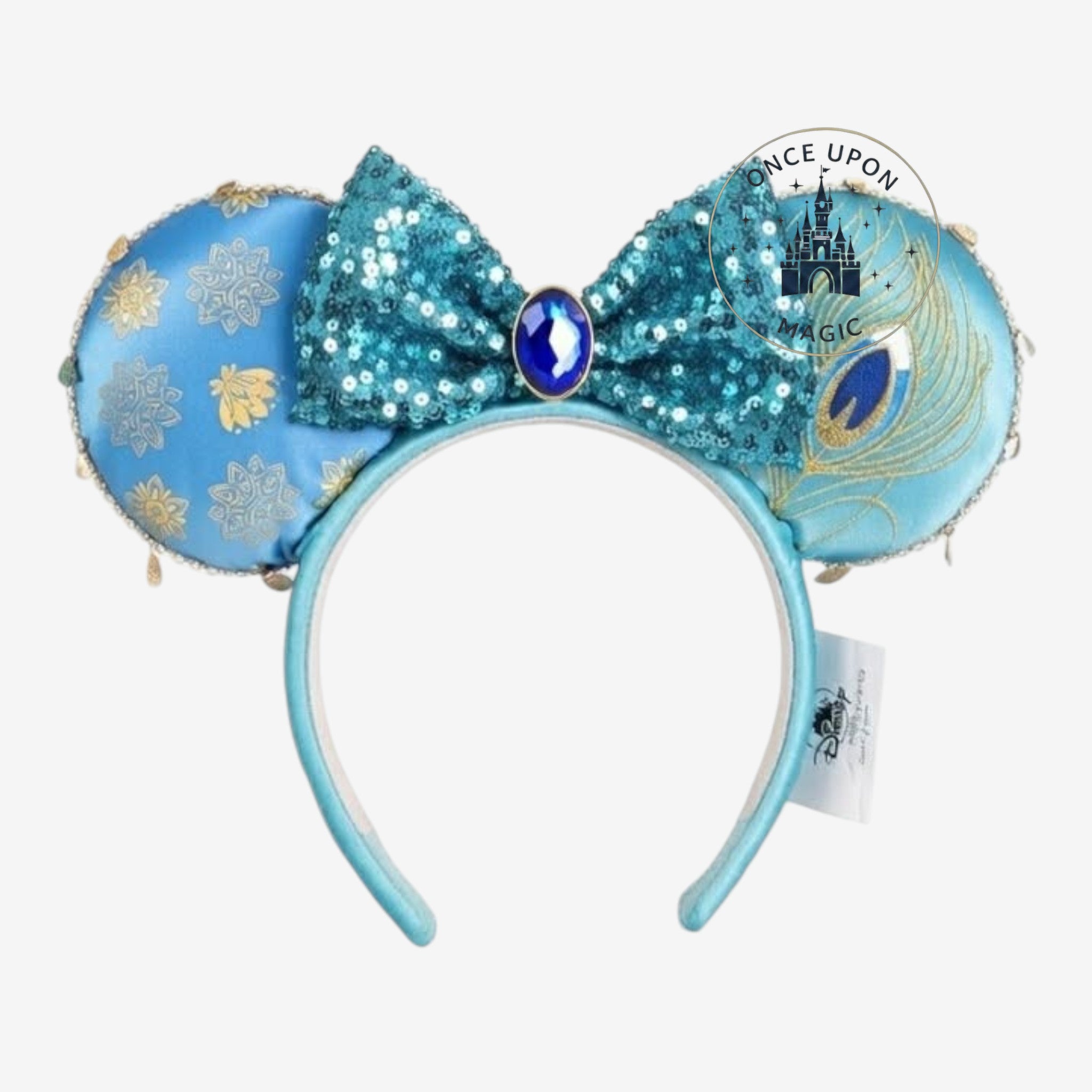 Once Upon Magic Jasmine ears headband with turquoise sequins bow and gold peacock feather details.