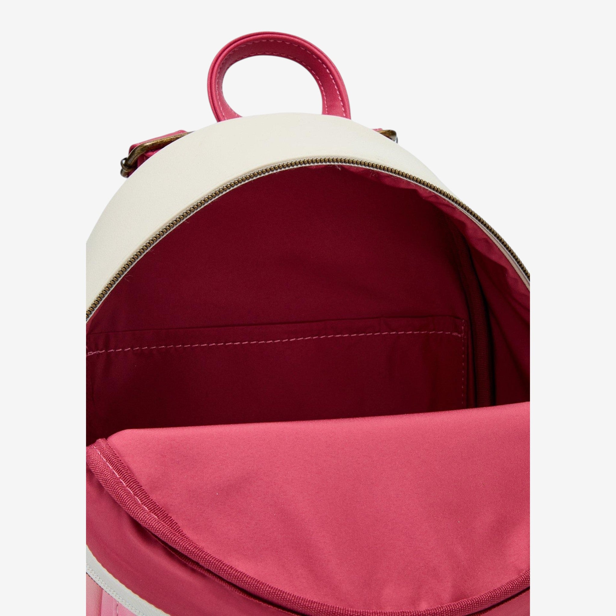 Once Upon Magic Lady and the Tramp mini backpack with white exterior and pink interior, featuring adjustable straps.