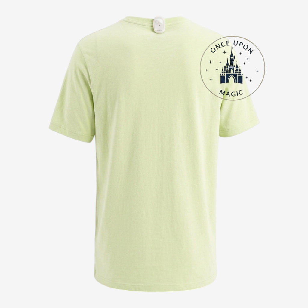 Once Upon Magic light green cotton t-shirt with a small white bell charm attached to the back collar.