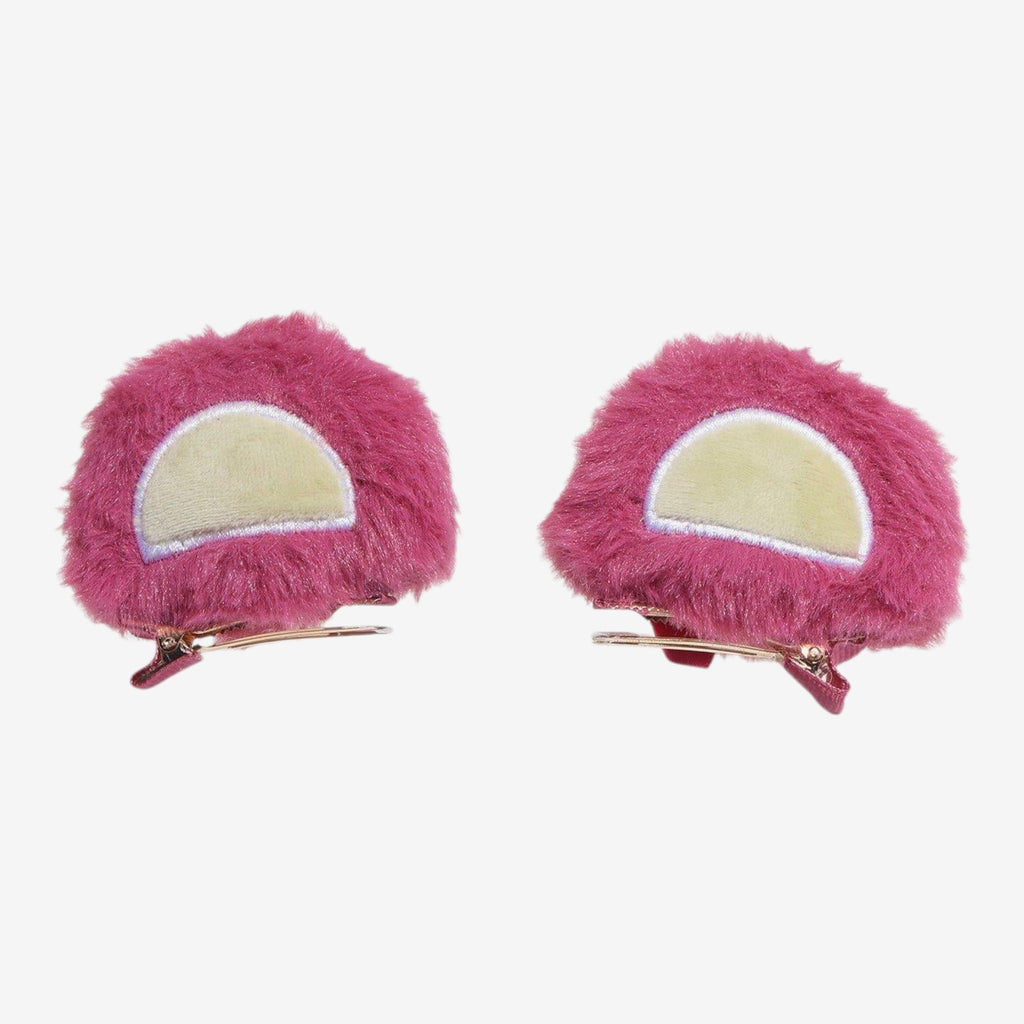 Once Upon Magic set of 2 pink fuzzy Lotso bear ear hair clips with cream inner ear detail. Polyester and zinc alloy.