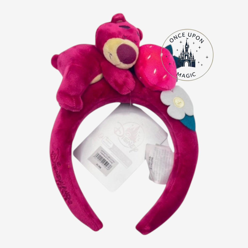 Once Upon Magic Disney Lotso plush headband in magenta velvet with strawberry and flower character details.