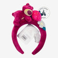 Once Upon Magic Disney Lotso plush headband in magenta velvet with strawberry and flower character details.