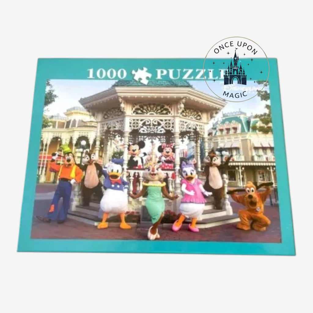 Once Upon Magic 1000-piece jigsaw puzzle featuring Mickey Mouse and friends in front of a Disneyland gazebo