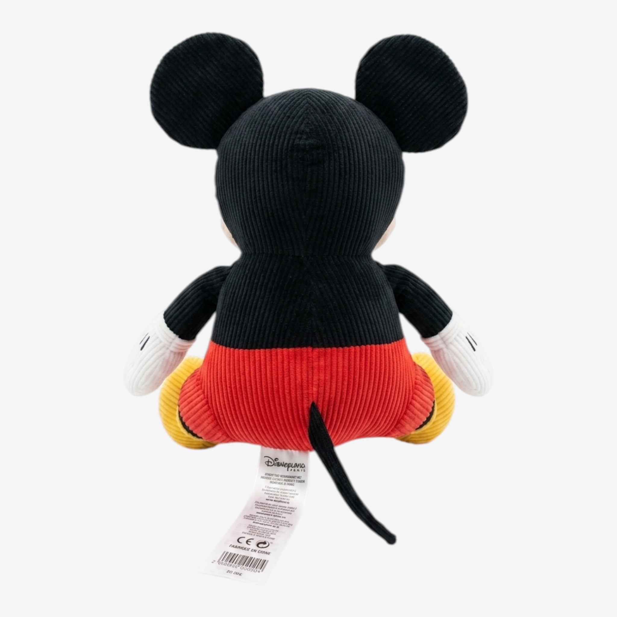 Once Upon Magic Disney Mickey Mouse corduroy plush toy in red shorts, yellow shoes, and black ears. Features a friendly smile.