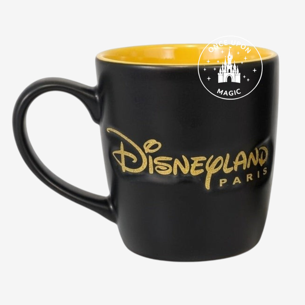 Once Upon Magic black matte mug with yellow interior, featuring Mickey Mouse and Disneyland Paris logo in gold.