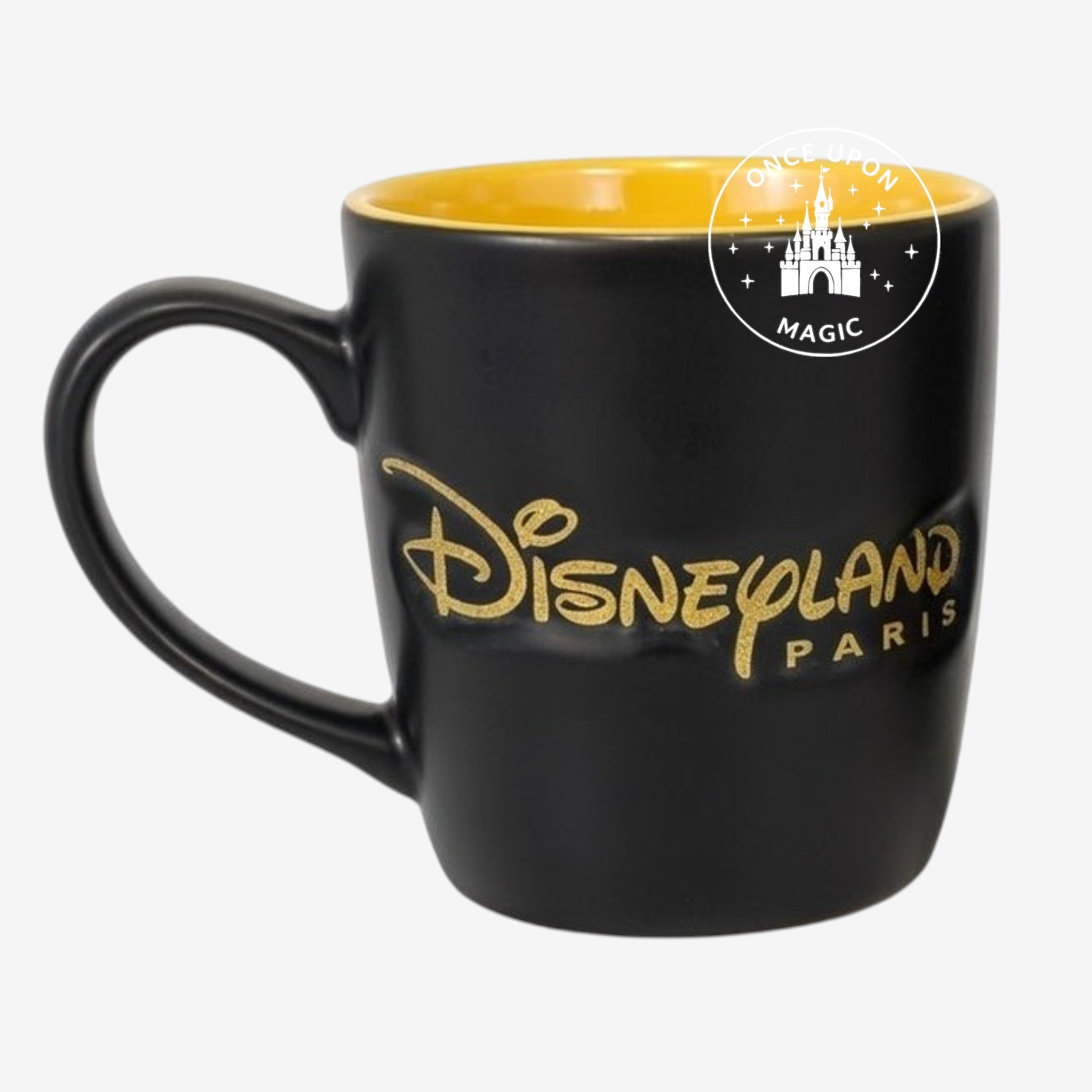 Once Upon Magic black matte mug with yellow interior, featuring Mickey Mouse and Disneyland Paris logo in gold.