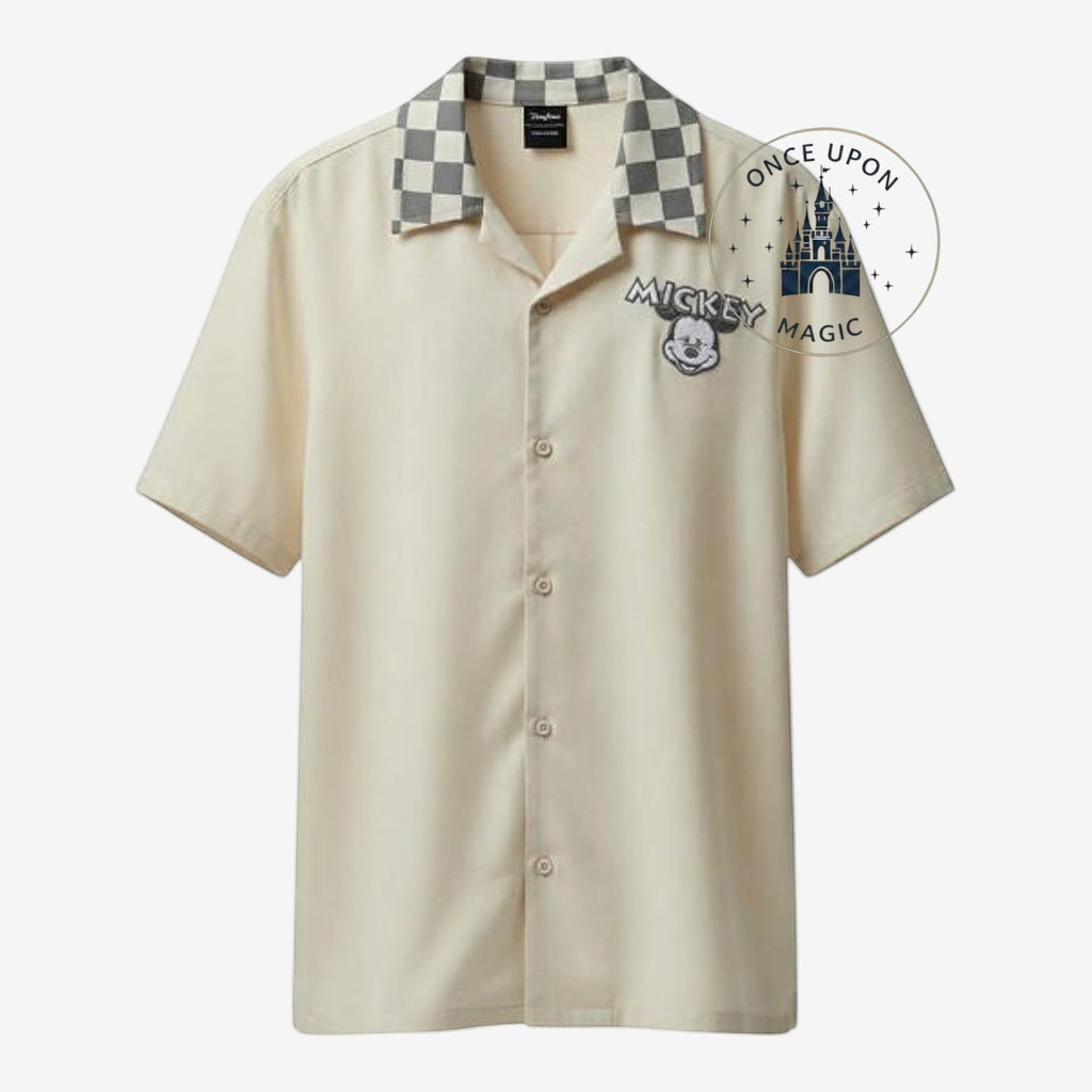 Once Upon Magic beige short-sleeve men's shirt with Mickey Mouse embroidery and checkered collar. Subtle Disney style.