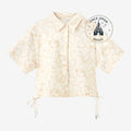 Once Upon Magic cream short-sleeve button-up shirt with all-over beige Mickey Mouse line art and drawstring sides.