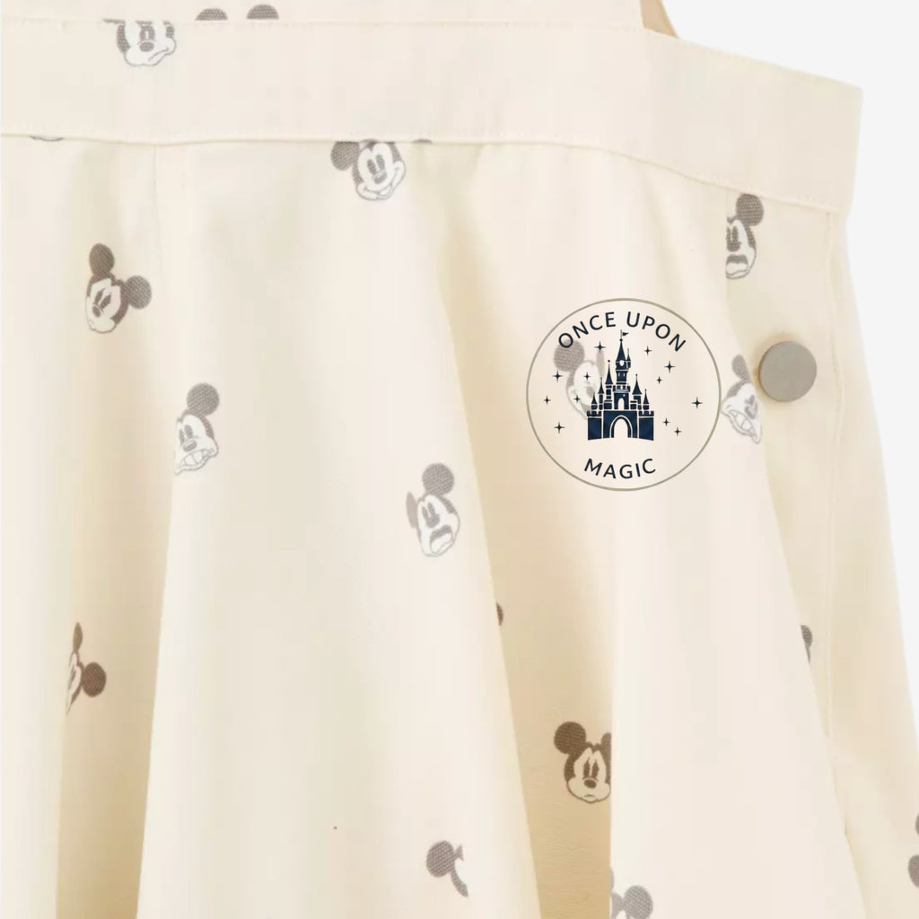 Once Upon Magic cream short overalls with all-over Mickey Mouse print and silver button detail.
