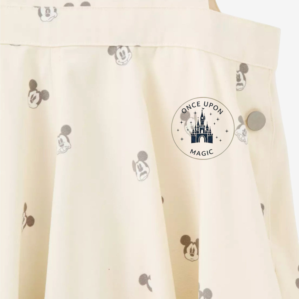 Once Upon Magic cream short overalls with all-over Mickey Mouse print and silver button detail.