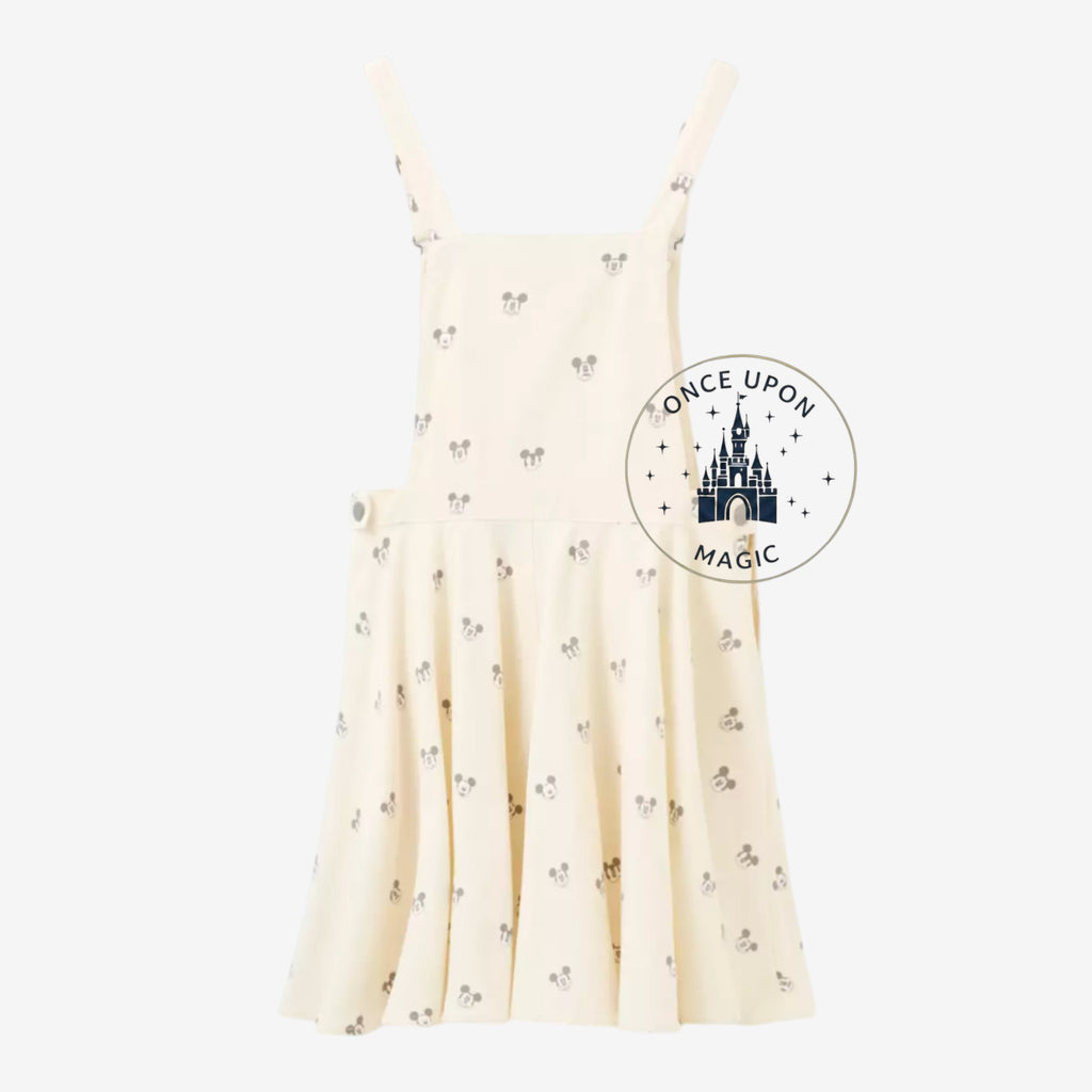 Once Upon Magic cream short overalls with all-over grey Mickey Mouse print. Features adjustable straps and a flared skirt.