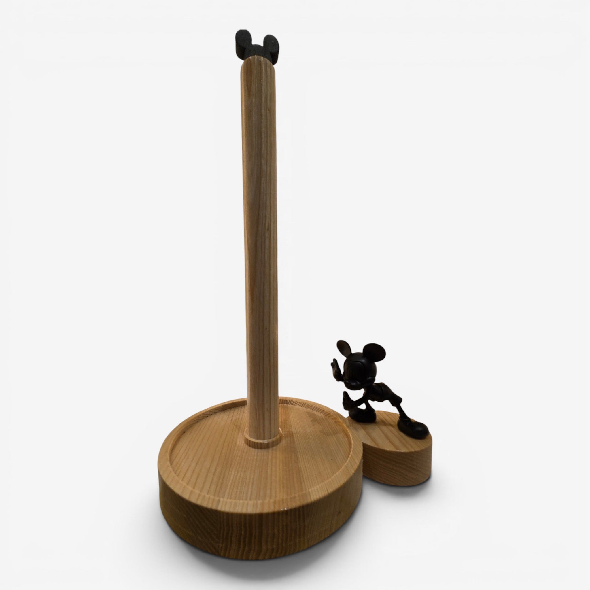 Once Upon Magic natural wood paper towel holder with Mickey Mouse head finial and black matte Mickey figure.