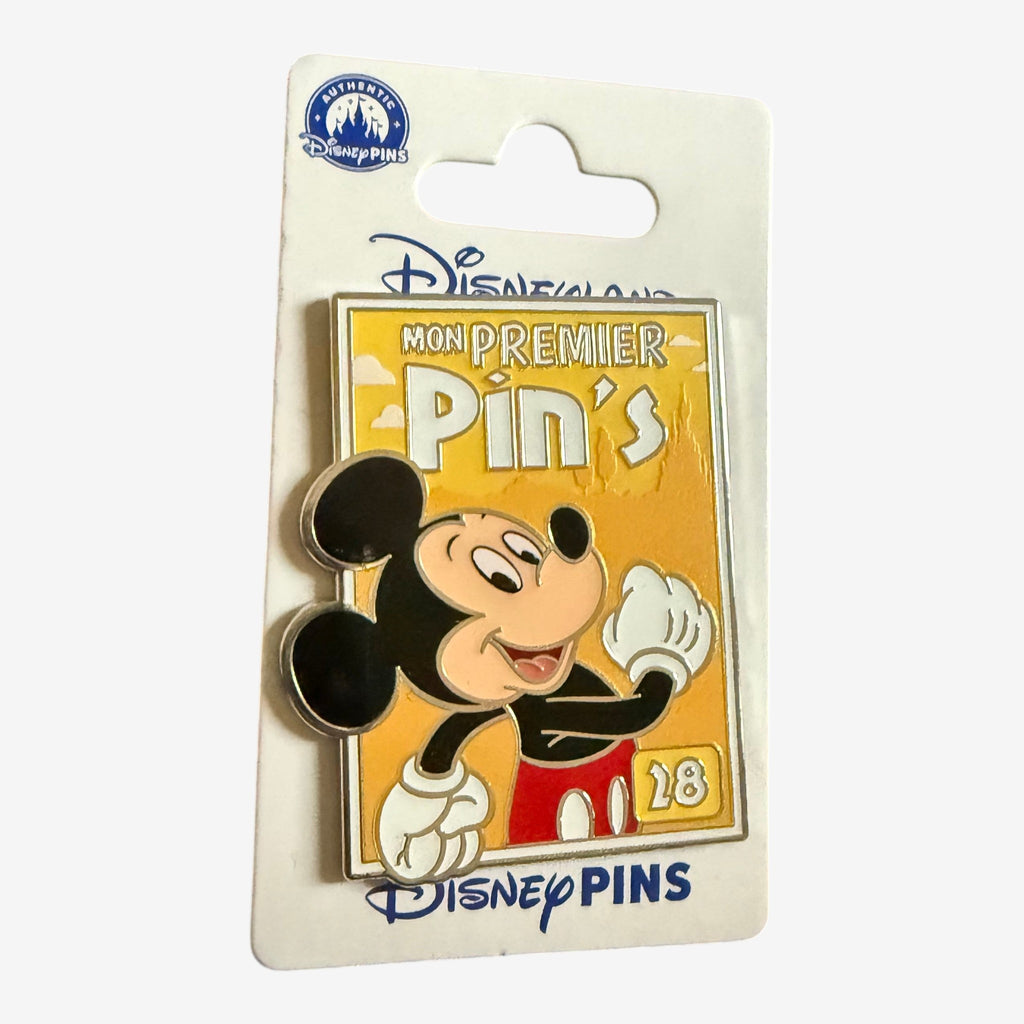 Once Upon Magic Disneyland Paris Mon Premier Pin's featuring Mickey Mouse on a yellow background with the number 18.