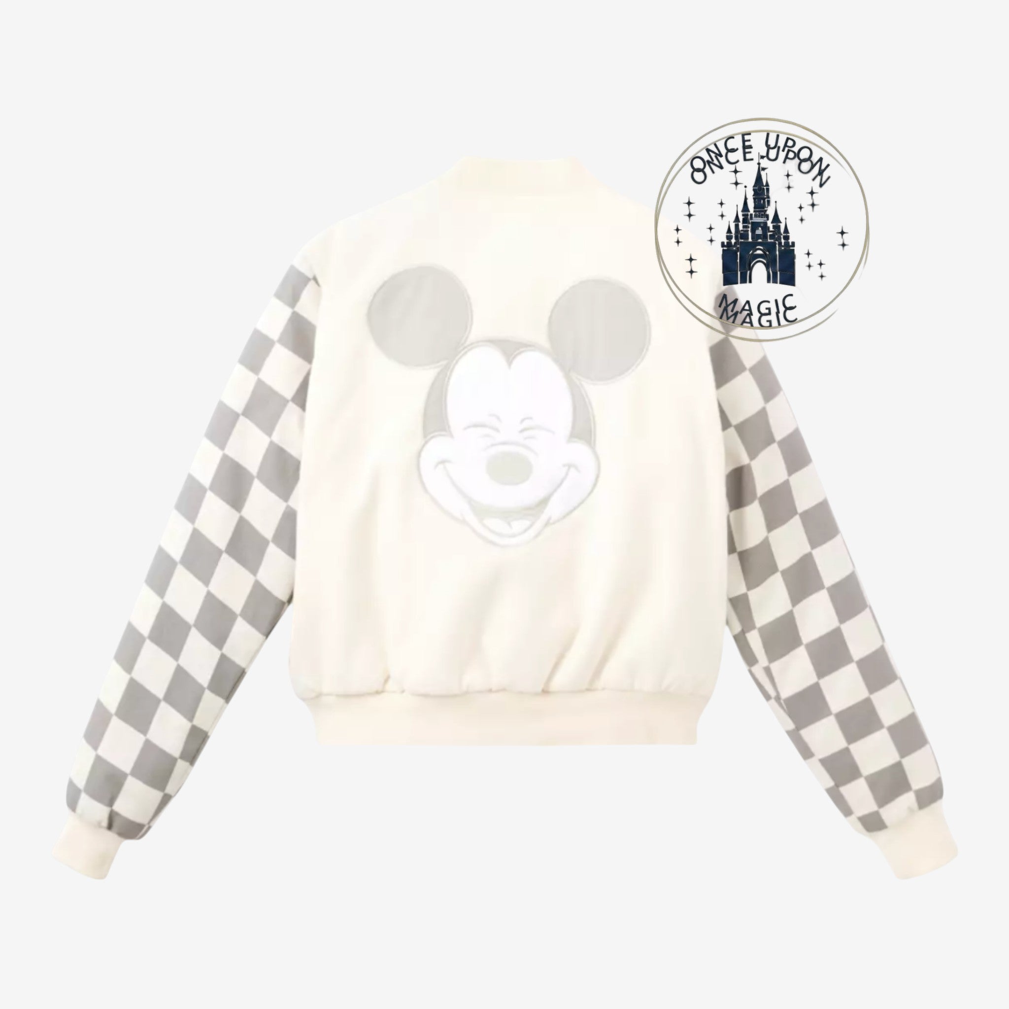 Once Upon Magic cream teddy varsity jacket with grey checkerboard sleeves and a large Mickey Mouse graphic on the back.