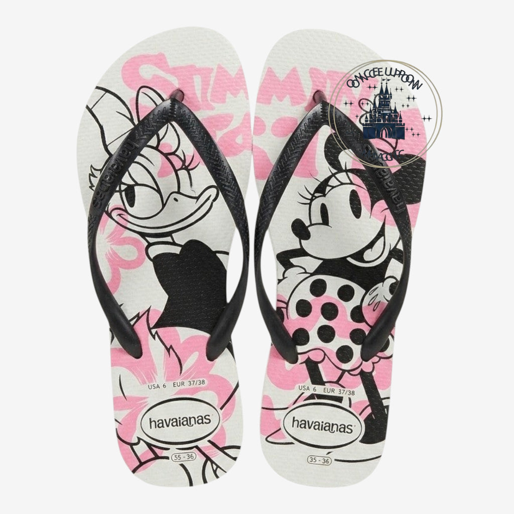 Once Upon Magic white rubber flip-flops with Minnie Mouse & Daisy Duck graphics in pink and black straps.