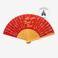 Once Upon Magic red folding fan with white polka dot Minnie Mouse bows and "All you Need is Bow" text. Natural wood handle.