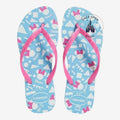 Once Upon Magic sky blue rubber flip-flops with pink Minnie Mouse bows and geometric pattern. Comfortable thong straps.