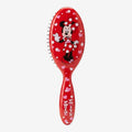 Once Upon Magic red hair brush with Minnie Mouse graphic and pink hearts. Features Minnie in her classic polka dot dress.
