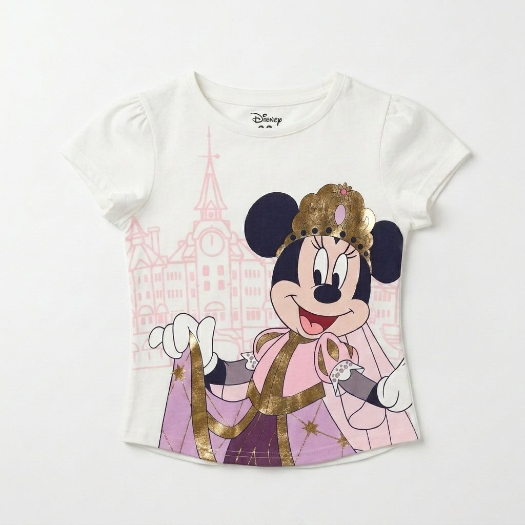 Once Upon Magic white cotton t-shirt with princess Minnie Mouse in a golden crown and pink gown, with a castle graphic.